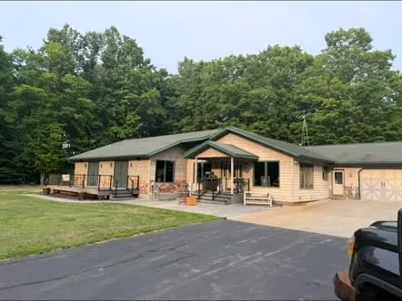 Ranch home with a new roof and stone front